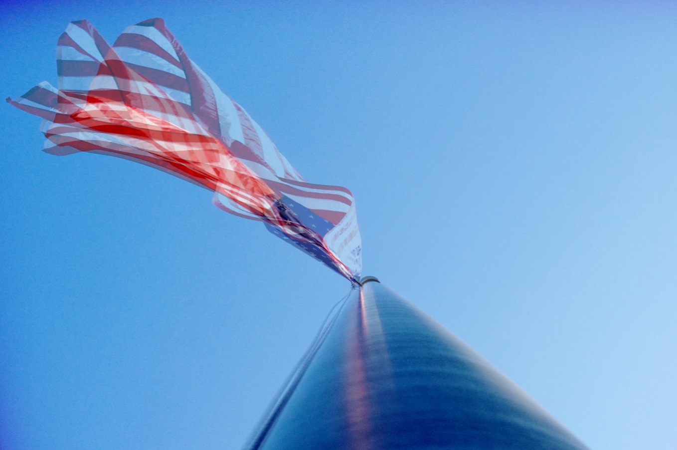 Flags flying / while people debate / our money.
