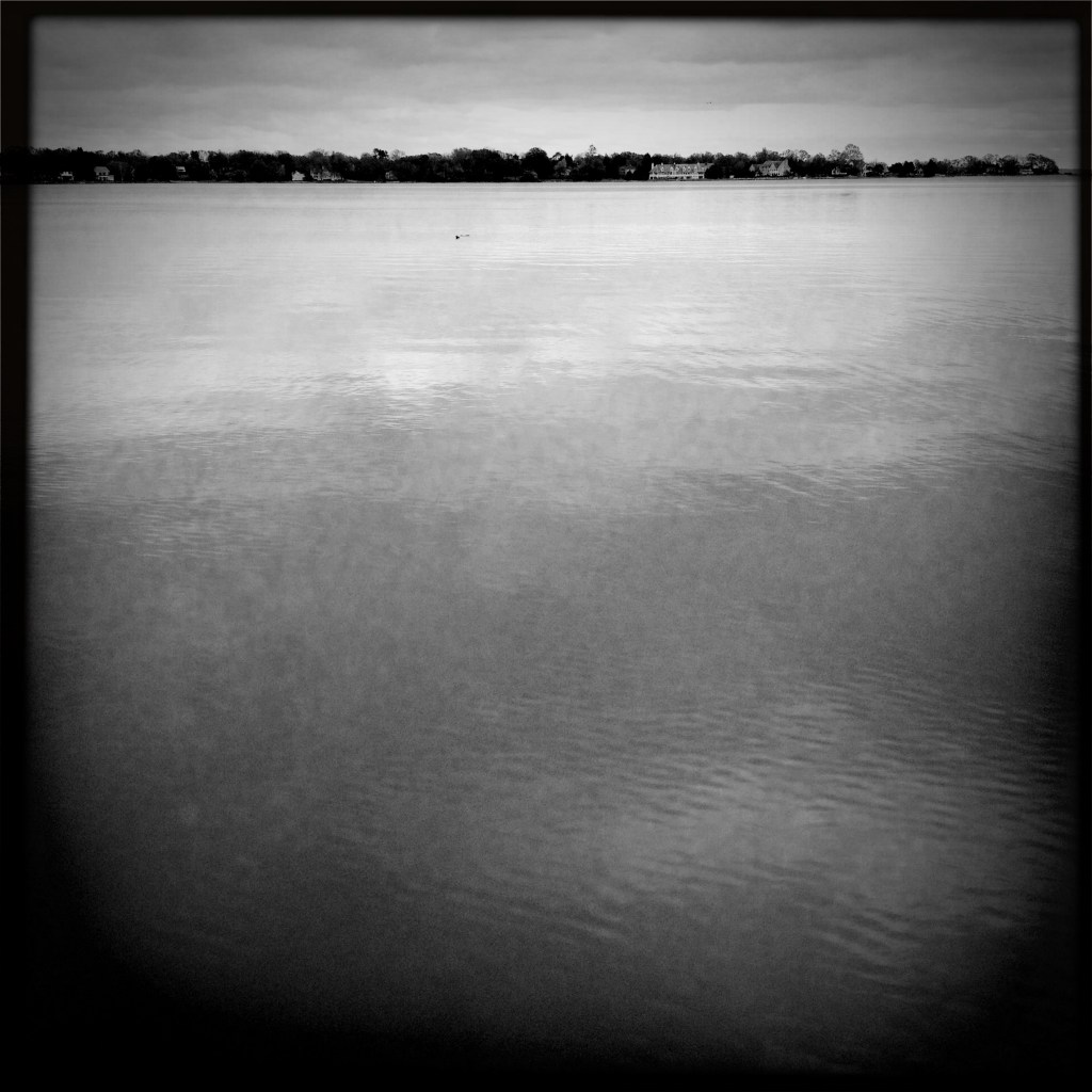 Water reflects / upon the angry / skies above. Calmly reflecting / the gray skies which recently / unleashed their fury.