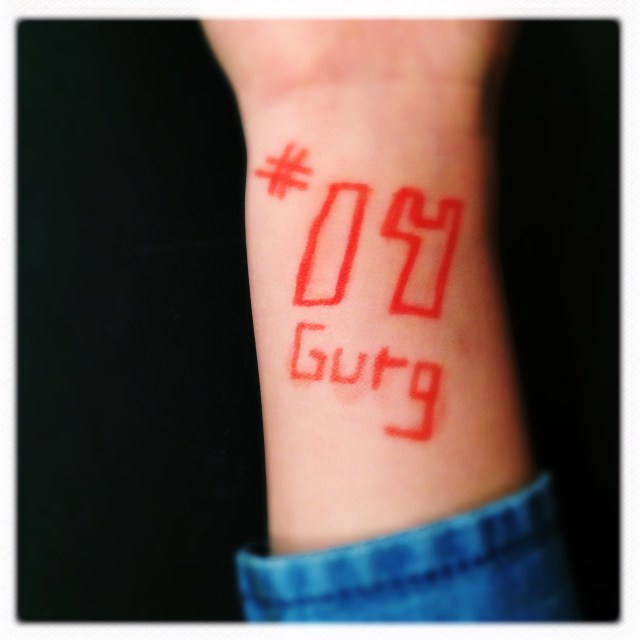 Expressing their grief / little wrists tattooed with his / number and nickname. | Haikumages
