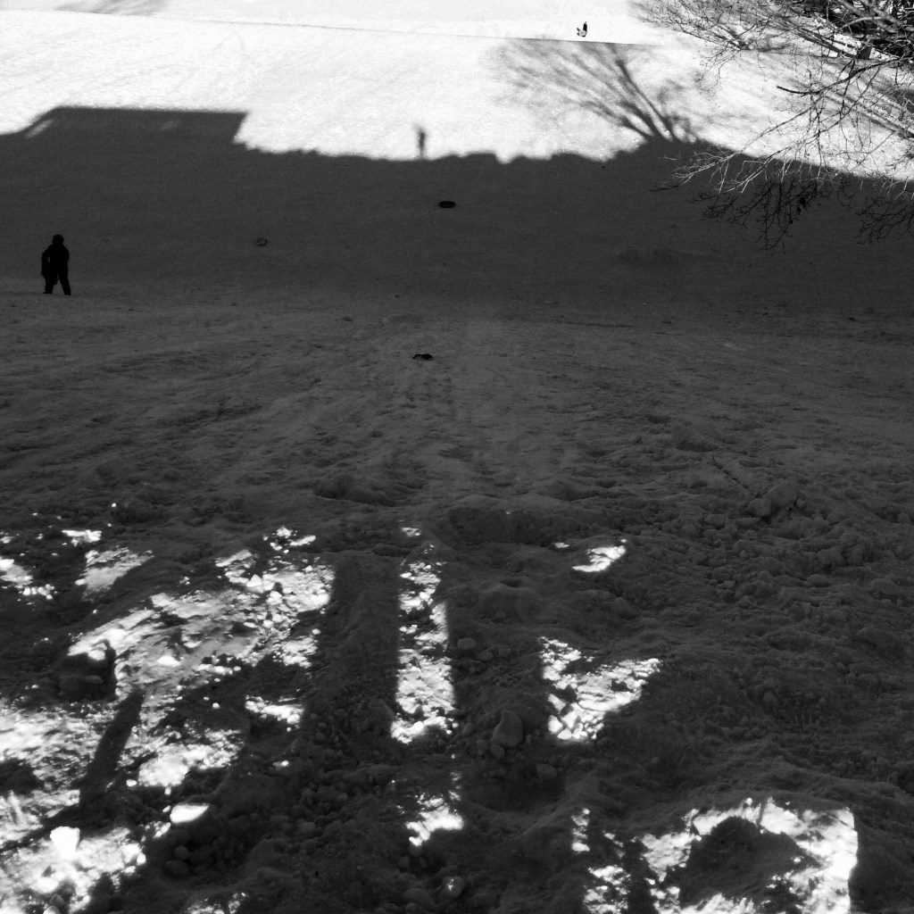 On the mountaintop / my shadow starts at the top / ends at the bottom. // haikumages