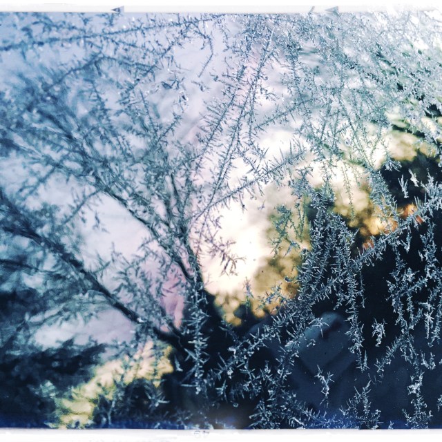 Sunrise viewed / through the ice crystals / on my car. // haikumages - haiku - micropoetry